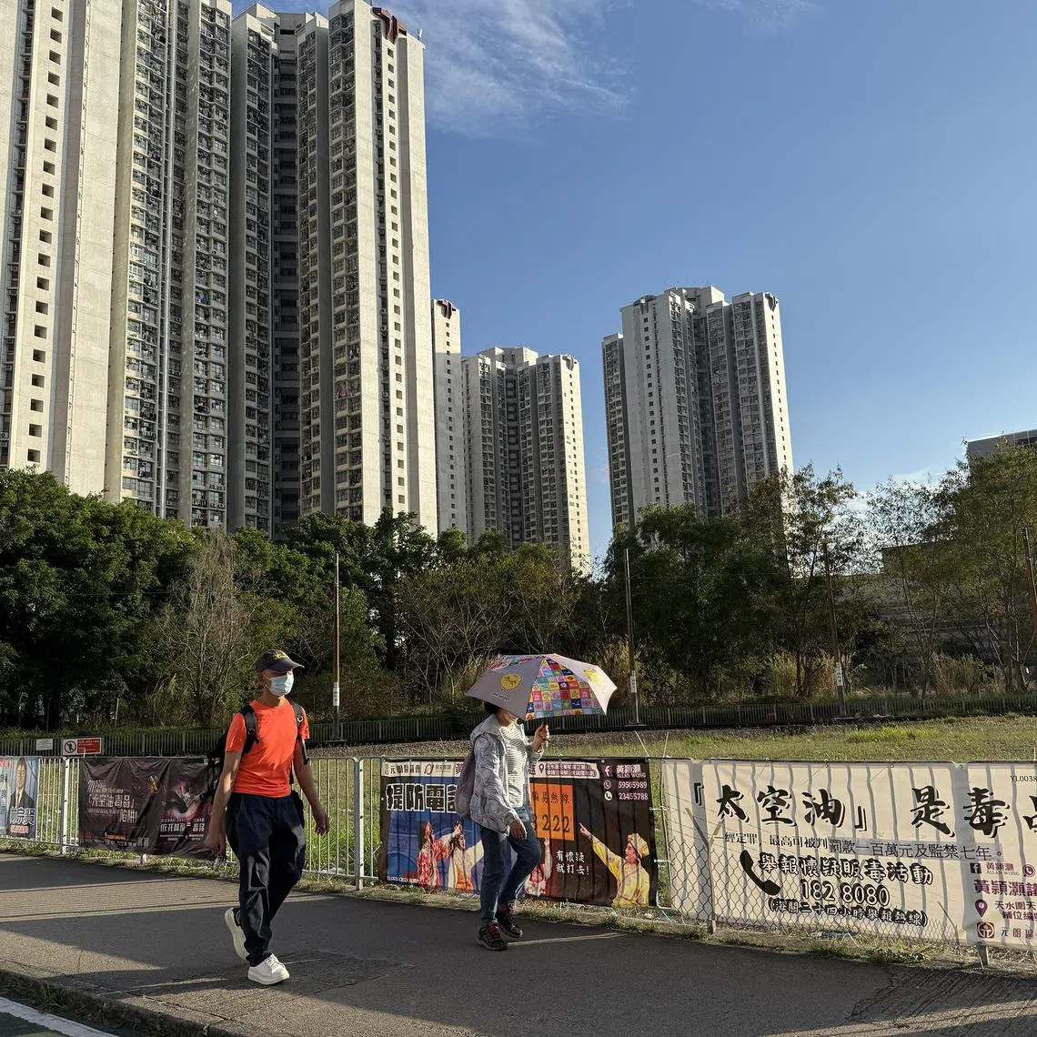 mfspace - Several banners warning against the dangers of space oil in a neighbourhood in Tin Shui Wai, Hong Kong.


ST PHOTO: MAGDALENE FUNG