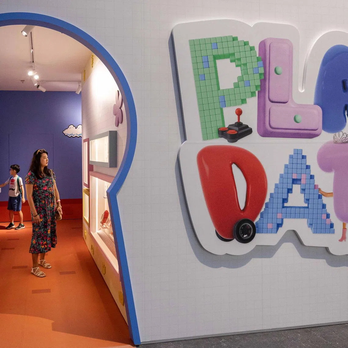 ST20240702_202466709957/clplay03/Brian Teo/Charmaine Lim/EMBARGO UNTIL JULY 3, 12PM. Members of the media touring the 'Play:Date – Unlocking Cabinets of Play' showcase during the media preview at National Museum on July 2, 2024. ST PHOTO: BRIAN TEO