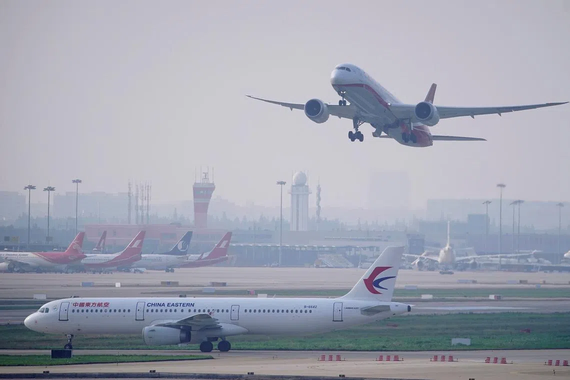 A China Eastern Airlines aircraft and  Shanghai Airlines aircraft are seen in Hongqiao International Airport in Shanghai, China June 4, 2020. REUTERS/Aly Song/FILE PHOTO
