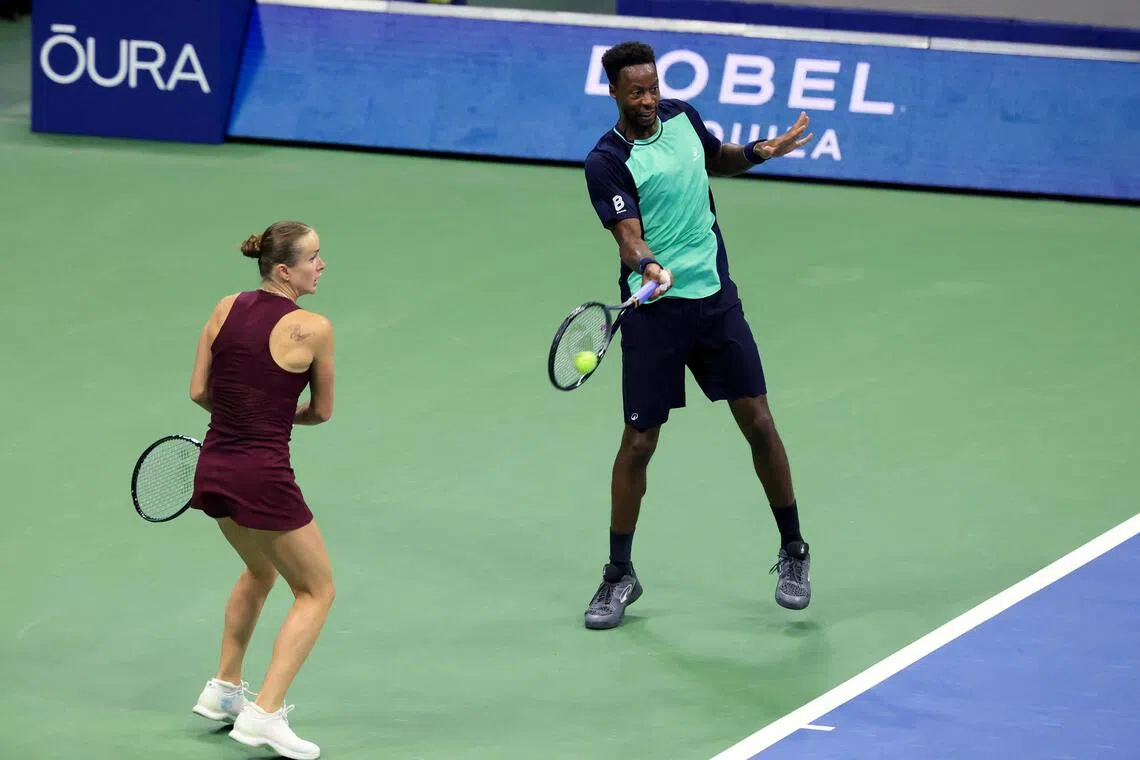 France’s Gael Monfils (right) and Ukraine’s Elina Svitolina in action during a mixed doubles match at the US Open in New York on Aug 26.