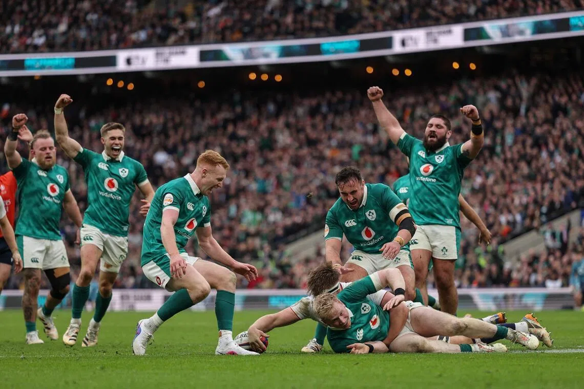 Ireland fullback Jamie Osborne (on the ground) going over the line to score a try during the 42-21 Six Nations' win over England at Twickenham in London on Feb 21, 2026.