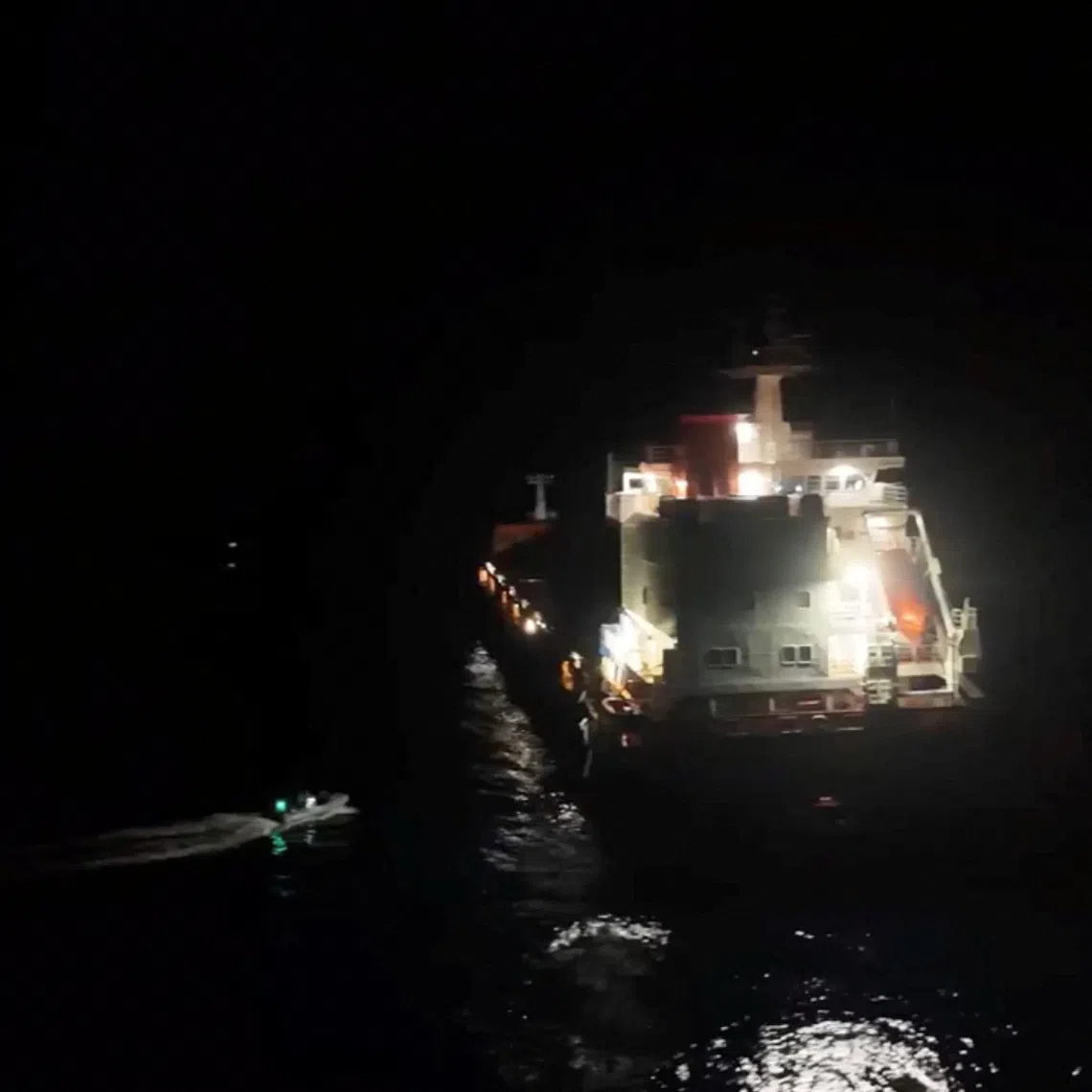 Personnel from EU maritime mission Eunavfor Aspides' carry out rescue operation following an attack by Yemen's Houthi on the Dutch-flagged general cargo ship Minervagracht, which caught fire in the Gulf of Aden on Monday, in this screengrab taken from handout video released on September 30, 2025. Eunavfor Aspides via X/Handout via REUTERS