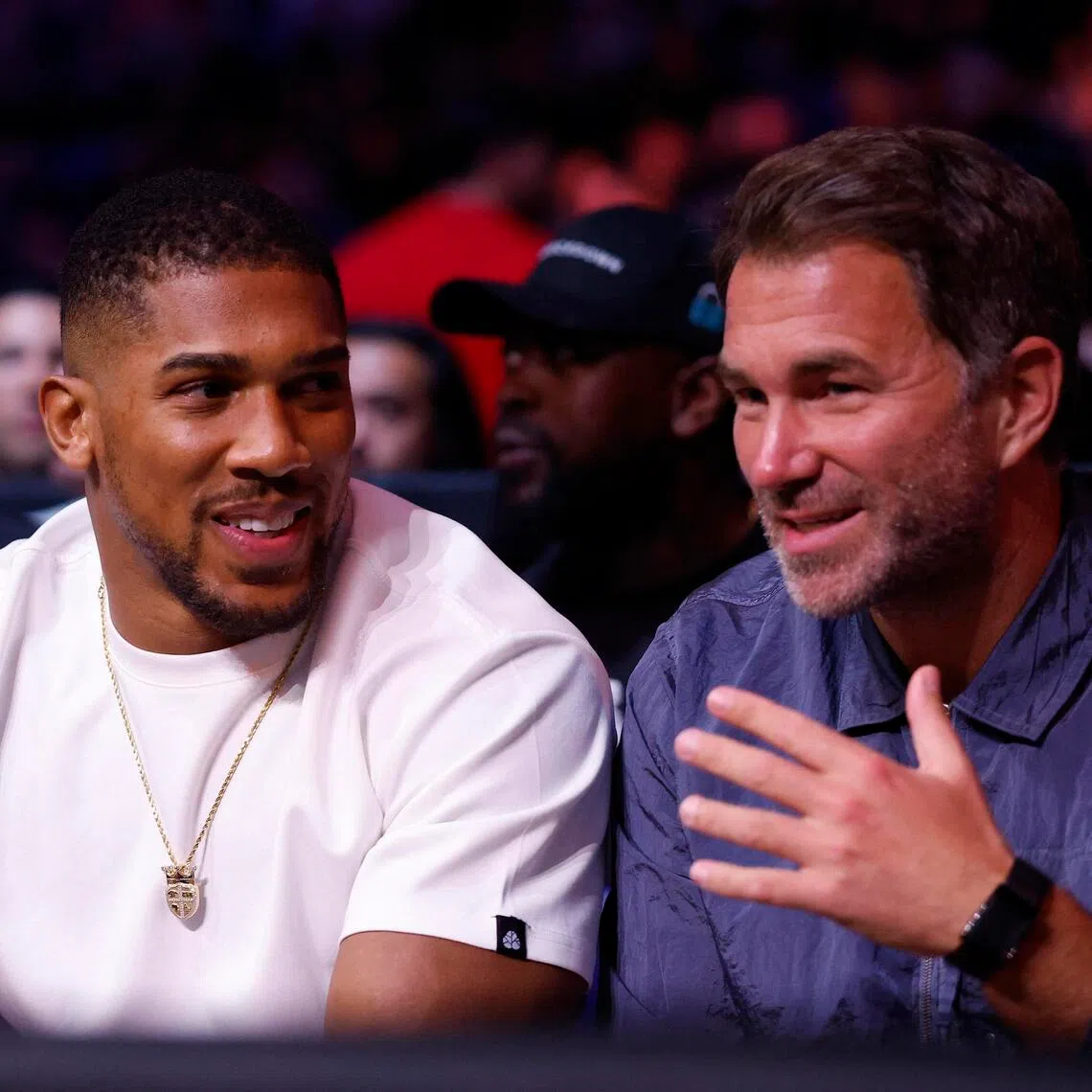 Former boxing champion Anthony Joshua (left) is seen with promoter Eddie Hearn ahead of the Derek Chisora-Deontay Wilder fight at London’s 02 Arena on April 4, 2026.