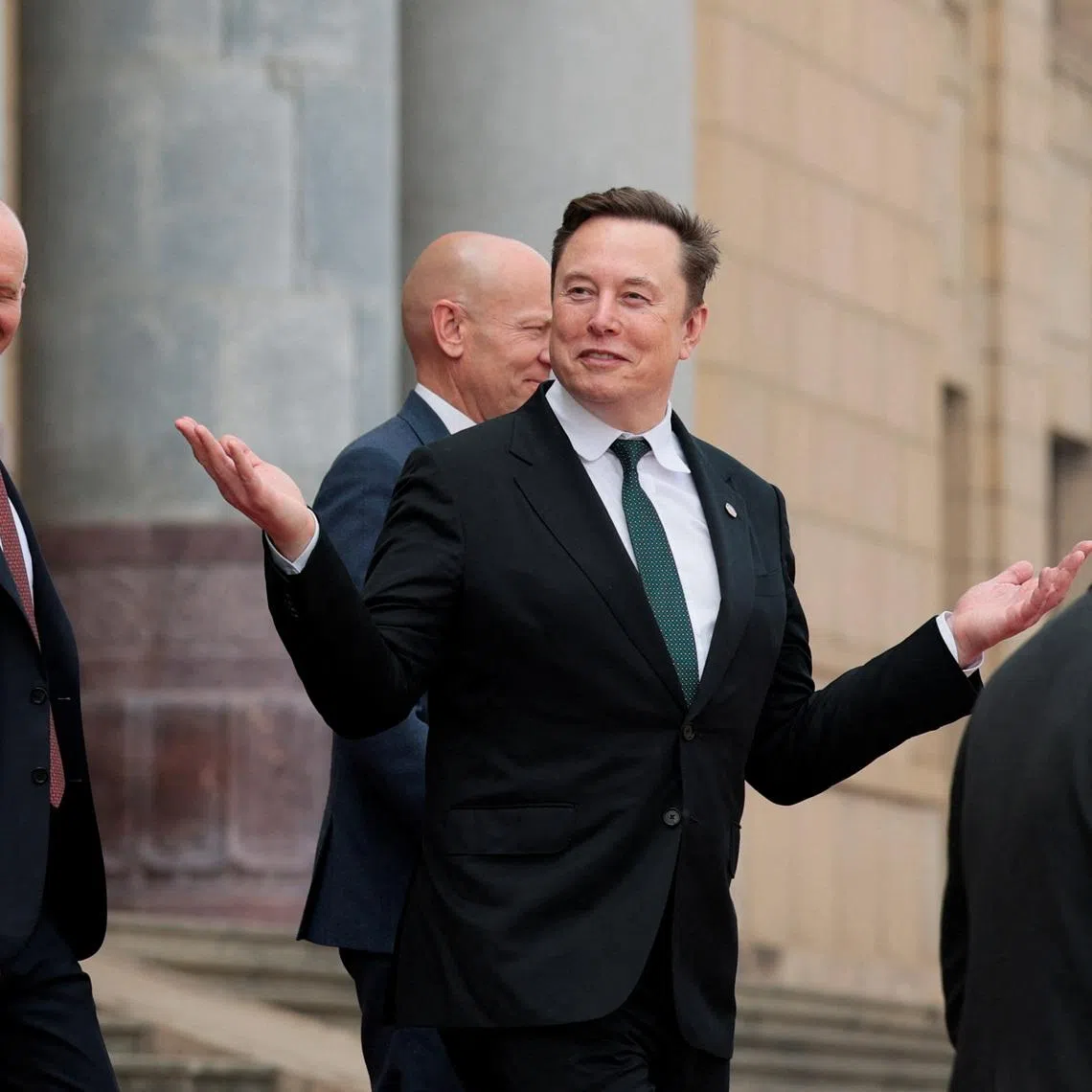 Elon Musk gestures as he leaves after attending a welcome ceremony for US President Donald Trump with Chinese President Xi Jinping in China on May 14.