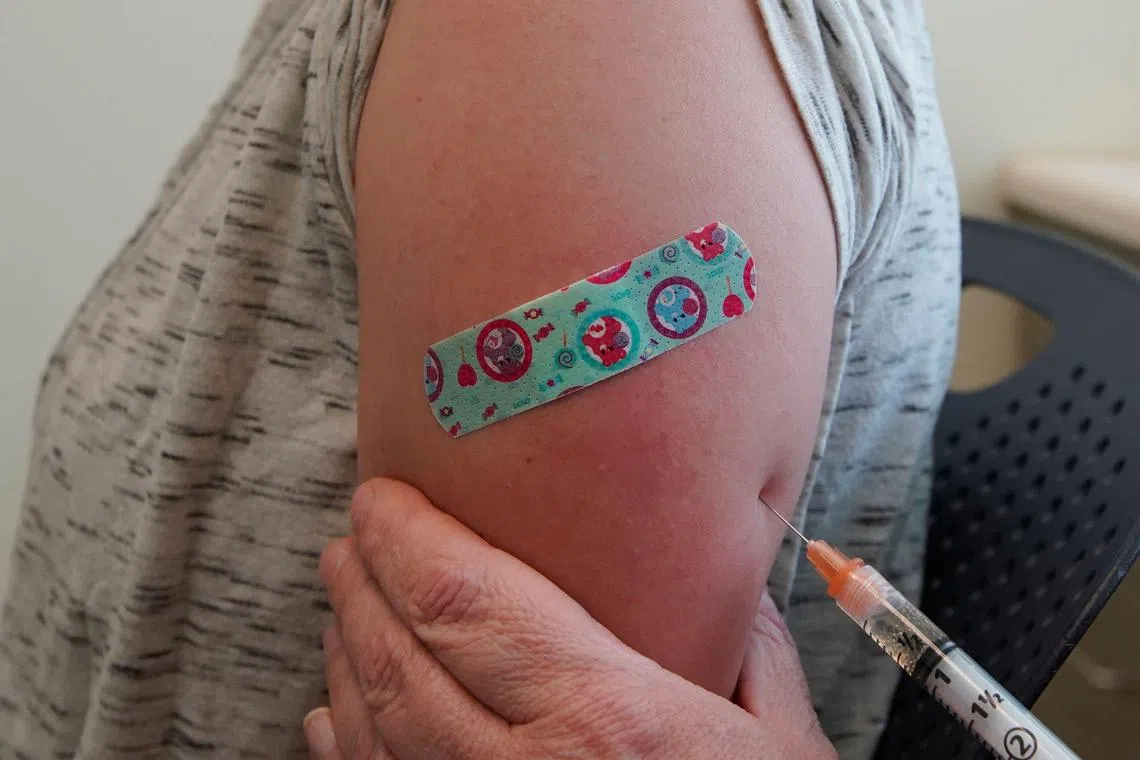 (FILES) A nurse gives Michaella a measles, mumps and rubella virus vaccine made by Merck at the Utah County Health Department on April 29, 2019 in Provo, Utah. A measles outbreak has killed a second child in the southwestern United States, authorities said on April 6, 2025, with almost 650 people now infected as the highly contagious disease spreads. As the US grapples with its worst measles outbreak in years, President Donald Trump's health secretary, Robert F. Kennedy Jr., has alarmed health experts with his past rhetoric downplaying the importance of vaccines. (Photo by GEORGE FREY / GETTY IMAGES NORTH AMERICA / AFP)