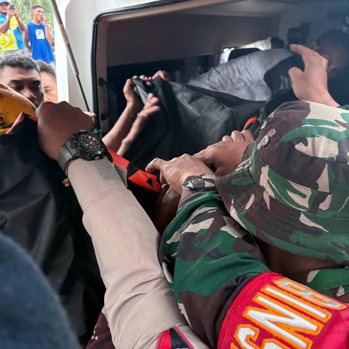 The bodies of the two Singaporeans who died climbing Mount Dukono being transferred to an ambulance to be brought to Tobelo Public General Hospital. 
