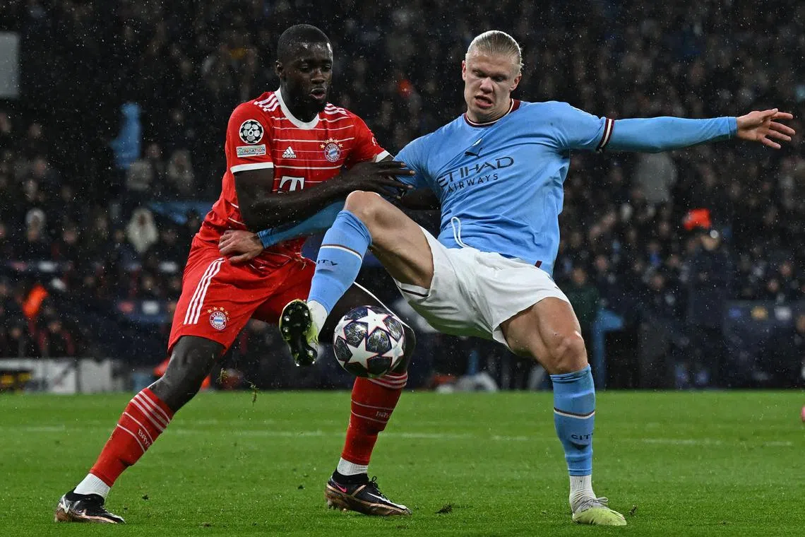 Bayern Munich defender Dayot Upamecano (left) vies with Manchester City striker Erling Haaland during the first leg of their Champions League quarter-final tie.