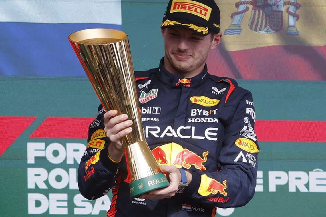 Formula One F1 - Brazilian Grand Prix - Jose Carlos Pace Circuit, Sao Paulo, Brazil - November 5, 2023 Red Bull's Max Verstappen celebrates with a trophy on the podium after winning the Brazilian Grand Prix REUTERS/Amanda Perobelli/File Photo