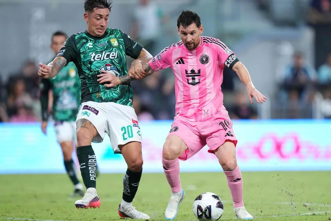 Inter Miami’s Lionel Messi taking on Rodrigo Echeverria of Leon in a Leagues Cup match on Aug 12.
