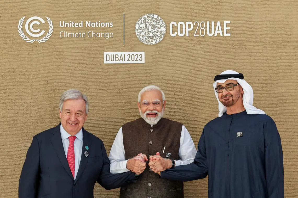 United Nations Secretary-General Antonio Guterres, India's Prime Minister Narendra Modi and President of the United Arab Emirates Sheikh Mohamed bin Zayed Al Nahyan attend the United Nations Climate Change Conference (COP28) at Expo City Dubai, in Dubai, United Arab Emirates, December 1, 2023. COP28 / Mahmoud Khaled/Handout via REUTERS    THIS IMAGE HAS BEEN SUPPLIED BY A THIRD PARTY.