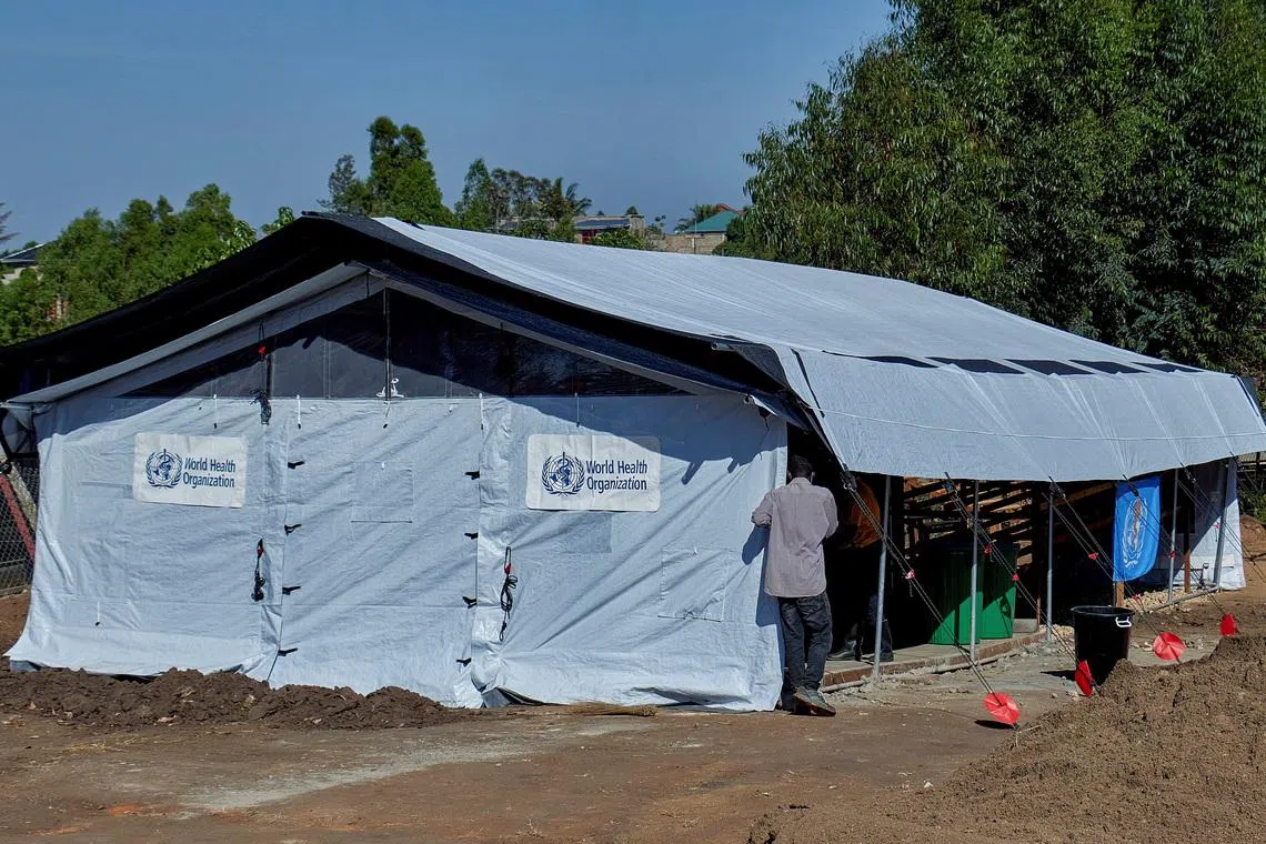 A health worker walks at the Evangelical Medical Center (CEM), one of the facilities at the forefront of the response to the Ebola outbreak, as agencies intensify efforts to contain a new Ebola outbreak caused by the Bundibugyo virus strain, in Bunia, Ituri province, Democratic Republic of Congo, May 31, 2026. REUTERS/Gradel Muyisa Mumbere