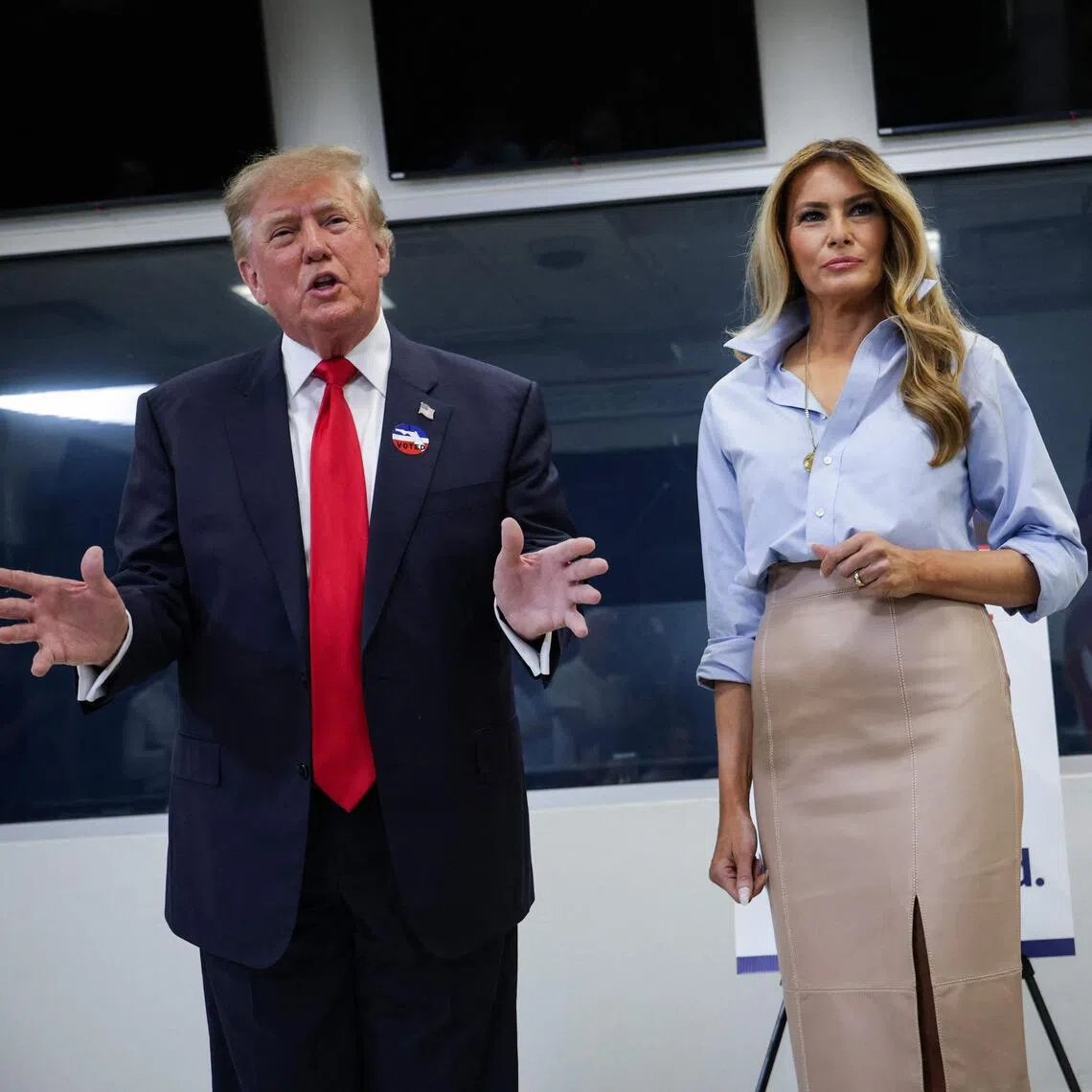 US President Donald Trump speaking to reporters alongside First Lady Melania Trump on Oct 24, after they cast their ballots in West Palm Beach, Florida.