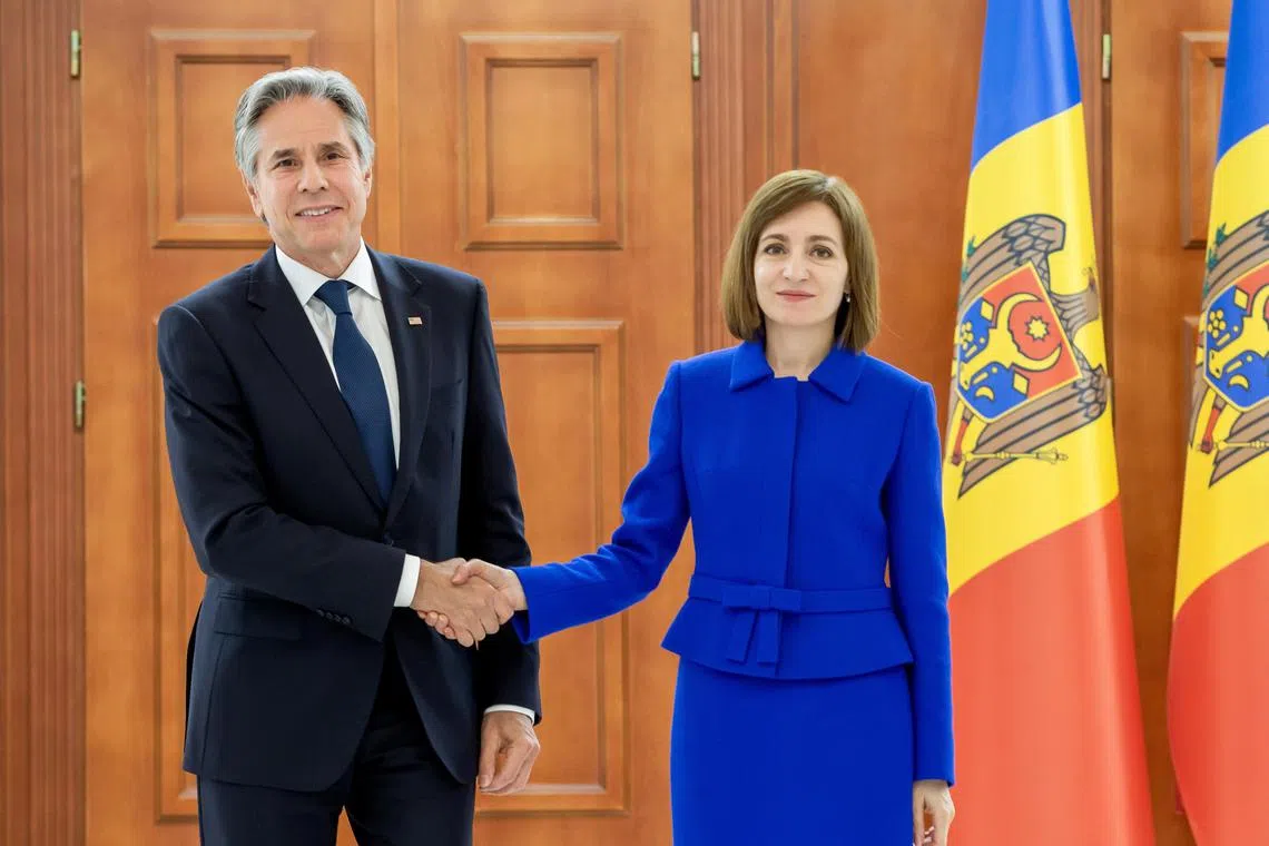 US Secretary of State Antony Blinken and Moldovan President Maia Sandu shake hands after their press briefing in Chisinau.
