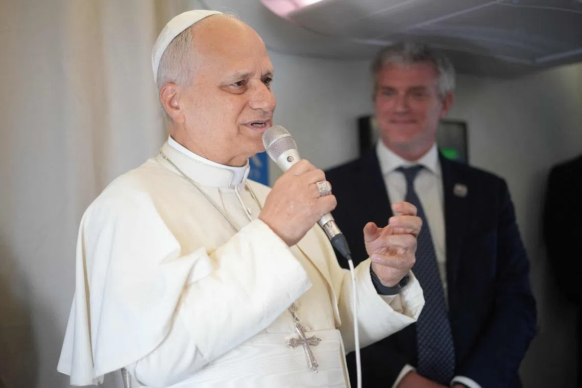 Pope Leo XIV speaks to journalists aboard the papal flight from Malabo to Rome, on April 23.