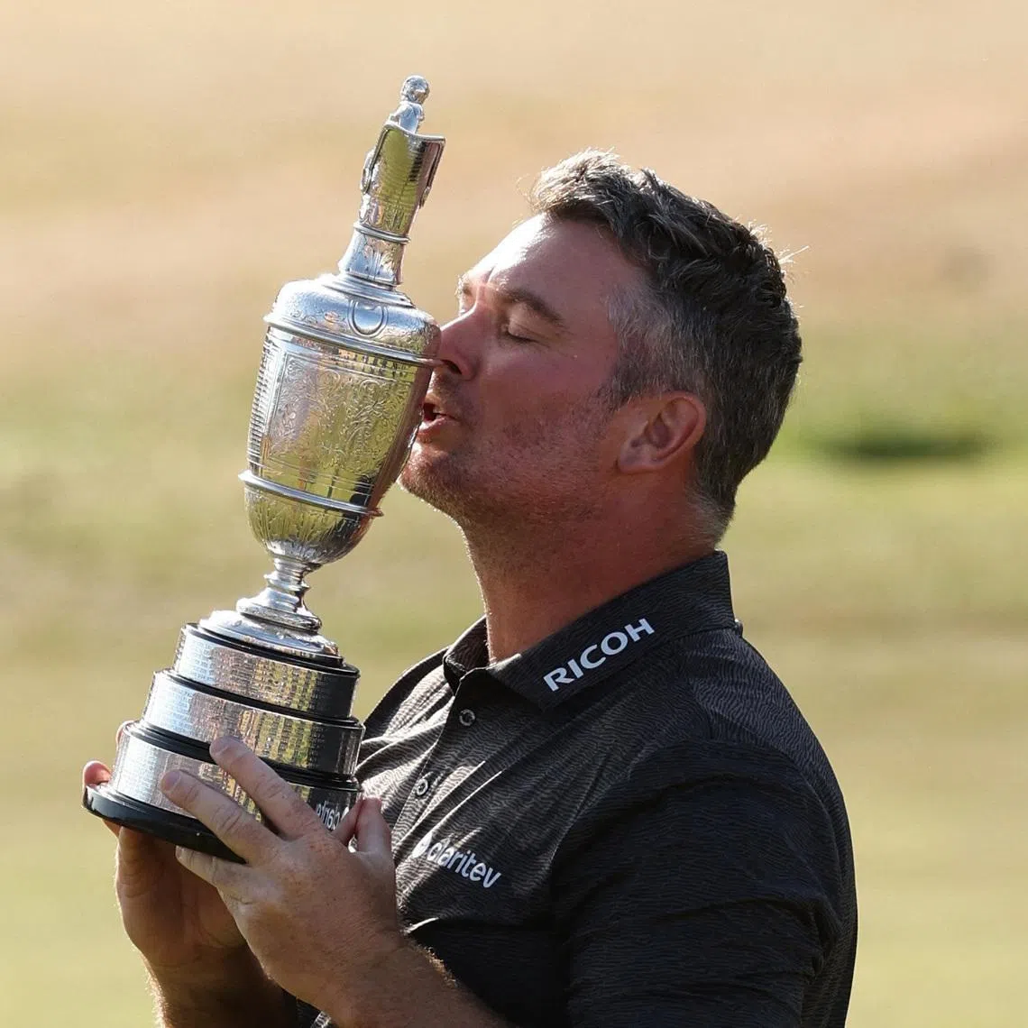 New Zealand’s Ryan Fox celebrates with the Claret Jug after winning The 154th Open Championship in Southport, Britain.