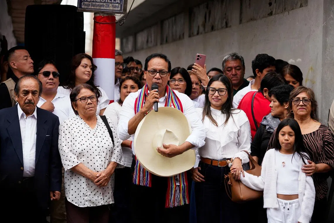 Left-wing presidential candidate Roberto Sanchez speaks to supporters next to his family members before casting his vote in a runoff election against conservative candidate Keiko Fujimori, in Huaral, Peru, June 7, 2026. REUTERS/Leslie Moreno