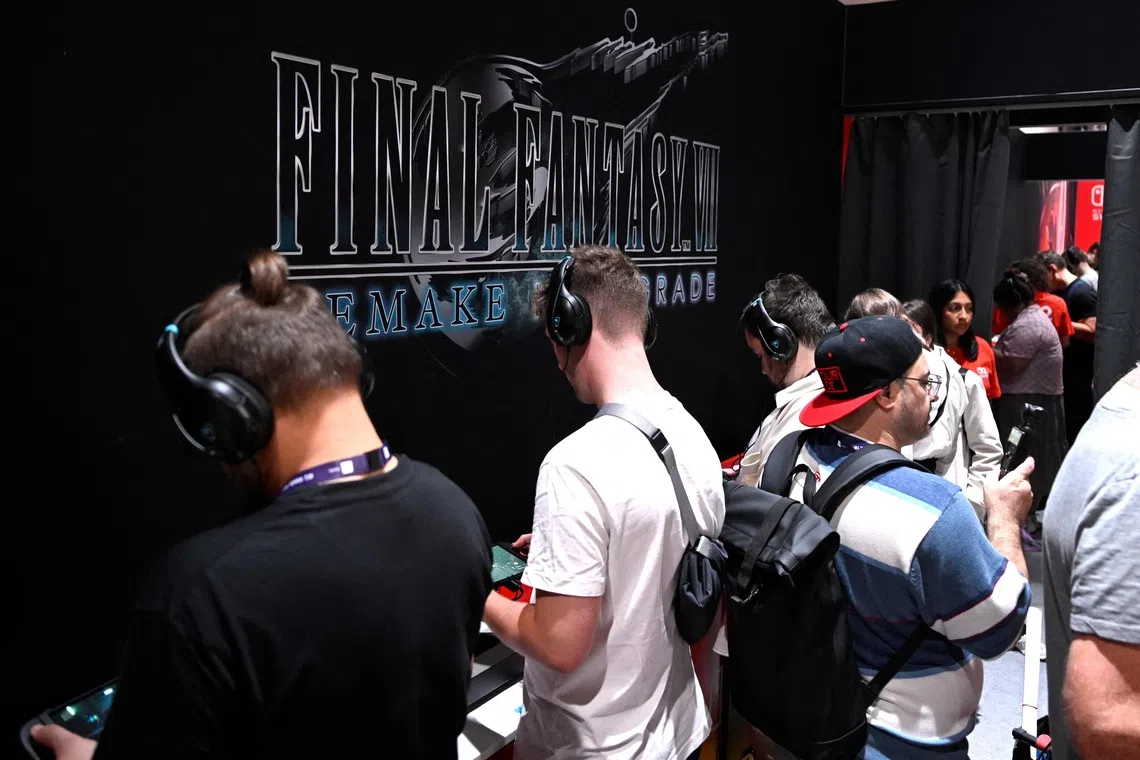 Gamers playing the Final Fantasy VI video game at the Nintendo booth during the Gamescom video games trade fair in Cologne, Germany, on Aug 21.