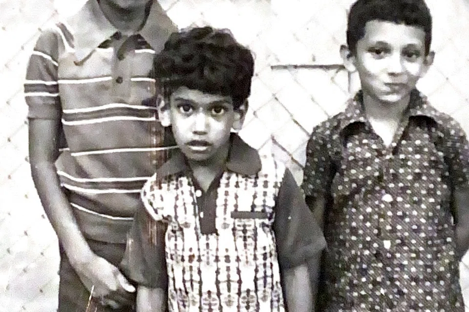 Mr Paul Thoppil (left) during his childhood with his younger brother Jacob (centre) and their cousin (right).