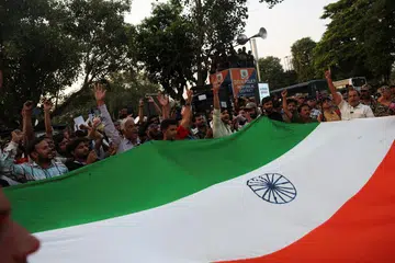 Protesters chant slogans as they take part in a flag rally by the Cockroach Janta Party (CJP) seeking the resignation of India's Chief Election Commissioner Gyanesh Kumar, in New Delhi, India, October 16, 2026.