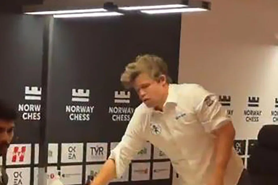 The chess pieces are strewn on the board after Magnus Carlsen slams the table, following the defeat by Gukesh Dommaraju.