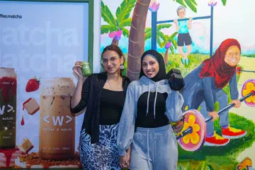 Sisters Uzma Mueez, 25, (left) and Shireen Taj, 30, at their neighbouring businesses located at Block 261 Waterloo Street.