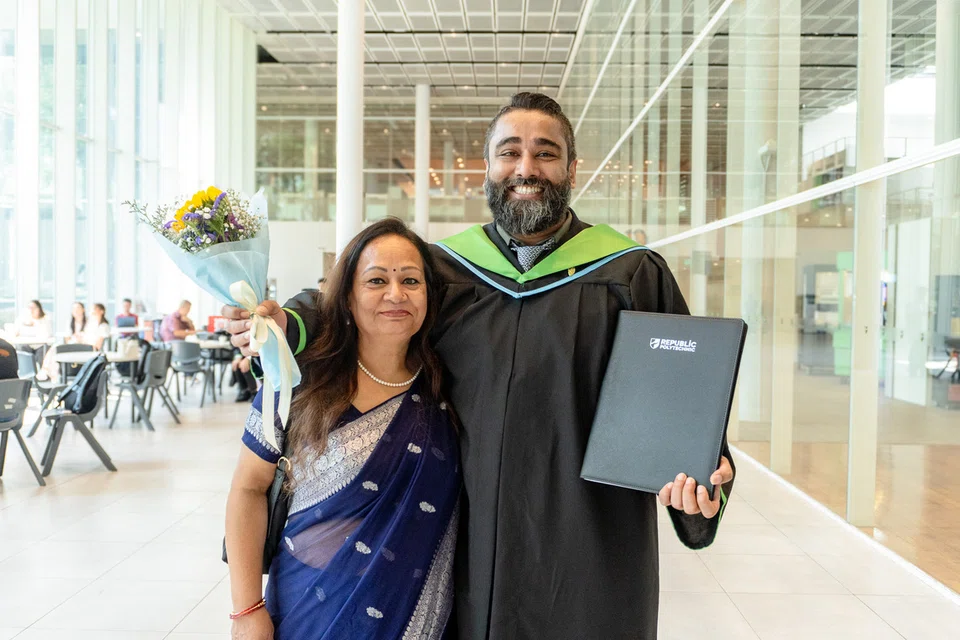Mr Anil Raj with his mother at graduation.