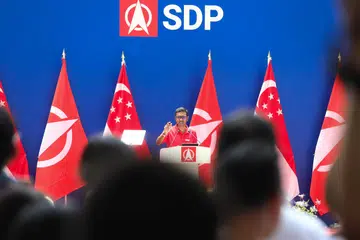 Ariffin Sha giving a speech at an SDP rally.