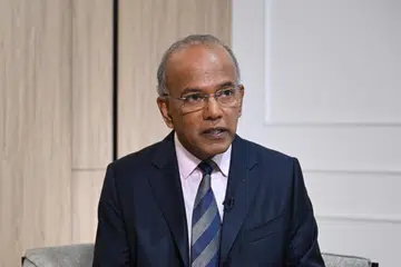 Home Affairs Minister K. Shanmugam (left) and Manpower Minister Tan See Leng were each awarded $230,000 in damages by the High Court on July 14.