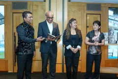 A copy of George Suppiah’s memoir ‘Beyond the Whistle’ was presented to President Tharman Shanmugaratnam by Suppiah’s grandson JK Saravana (left), daughter Shamini Suppiah (second from right), and daughter-in-law Whoy Chong.