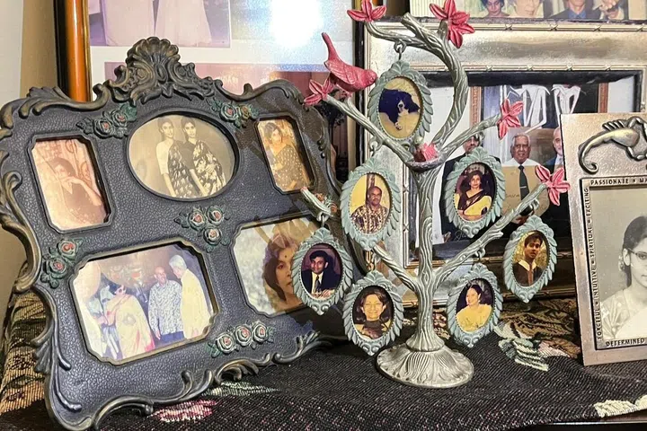 The Kesavapany family tree displays pictures of each member, with Benji placed at the top.