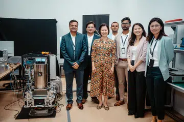 Atomionics opened Asia’s first integrated quantum sensing hub in Alexandra Technopark. (From left) Co-founders Dr Ravi Kumar and Sahil Tapiawala and the guest of honour for the opening, Minister of State for Trade and Industry Gan Siow Huang, standing near a GRAVIO machine.