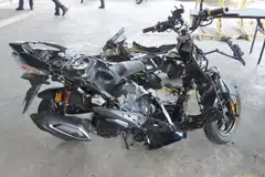 A motorcycle’s bodywork taken apart after ICA officers flagged the vehicle for attempted smuggling of contraband cigarettes in 2025.