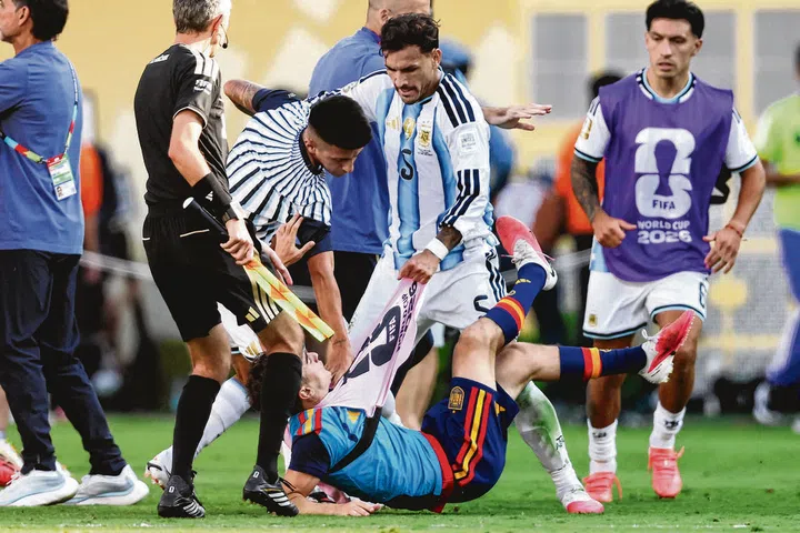 Argentina's midfielder Leandro Paredes clashes with Spain's midfielder Gavi during the 2026 World Cup football tournament final match between Spain and Argentina.