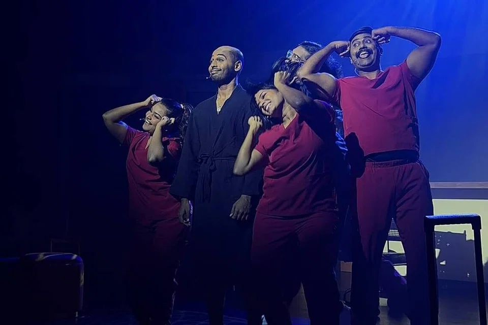 Yugesh Kannan plays the male character Kovan, surrounded by an ensemble cast.