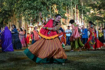 Maharani of Baroda Radhikaraje Gaekwad  performs the Garba' dance as part of the Navratri festival at the Laxmi Vilas Palace in Vadodara on Oct 11.