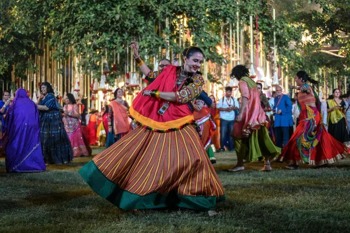 Maharani of Baroda Radhikaraje Gaekwad  performs the Garba' dance as part of the Navratri festival at the Laxmi Vilas Palace in Vadodara on Oct 11.