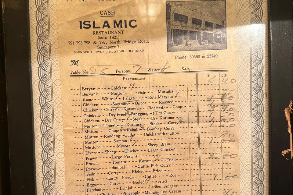 A receipt from 1962, framed and displayed at Islamic Restaurant, indicates duck on the menu. (Right) A sign outside Trio shopping mall where Bama’s Kitchen is located.