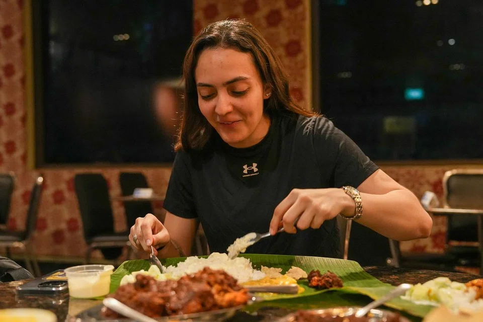 Fencer Amita Berthier tucking into her meal at Samy’s Curry.