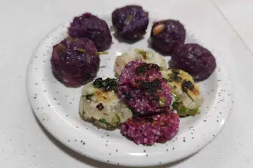 Homemade steamed sweet potato sago balls, and fried potato (white) and sweet potato (purple) sago vada.