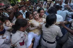 Indian security personnel detain All India Students' Association (AISA) National President Neha Bora, along with other social activists and student activists from left parties, during a protest demanding the resignation of Chief Election Commissioner Gyanesh Kumar near Jantar Mantar in New Delhi, India, 04 October 2026.