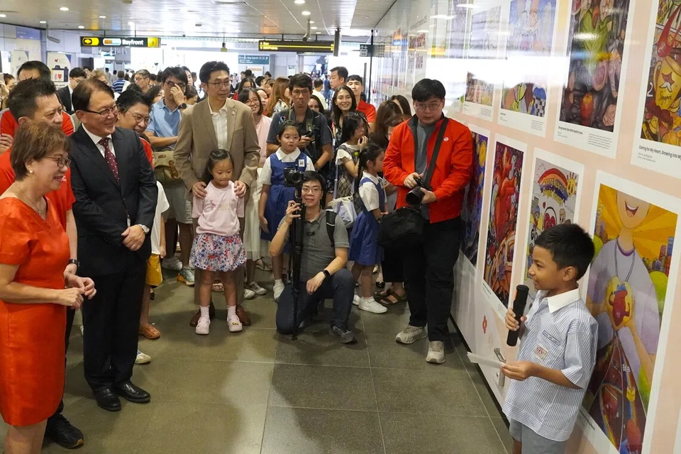 A younger participant presented his shortlisted artwork to Mayor of Central Singapore and MP for Jalan Besar GRC Denise Phua.