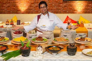 Chef Devagi Sanmugam with the dishes she prepared for Ayalagam.