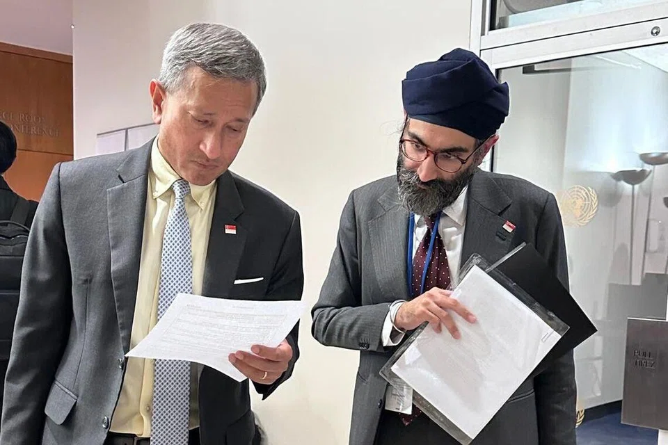 Minister for Foreign Affairs Vivian Balakrishnan (left) and Mr Navjote Singh Sachdev reading the draft for the minister’s speech at the UN General Assembly in September 2025.