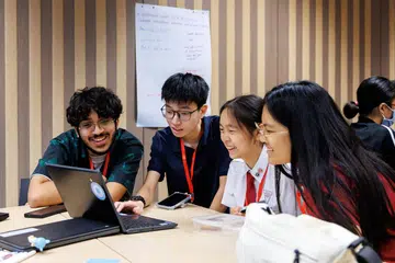 Participants collaborate during breakout discussions, sharing their perspectives on tackling modern digital challenges and promoting social harmony online.