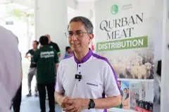 Acting Minister-in-charge of Muslim Affairs and Senior Minister of State, Ministry of Home Affairs, Assoc Prof Dr Muhammad Faishal Ibrahim (in White and Purple Polo shirt) at a Jamiyah Singapore Qurban meat distribution session held in Eunos to residents and beneficiaries on 5 July 2026.
