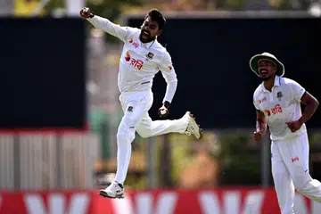 Bangladesh bowler Mehidy Hasan Miraz celebrates dismissing Australia's batsman Beau Webster on the fourth day of the first cricket Test match between Australia and Bangladesh at Marrara Stadium in Darwin on August 16, 2026.