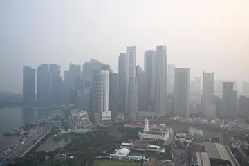 Haze shrouding the Singapore skyline taken from Swissotel The Stamford at about 6pm on Oct 7, 2026.