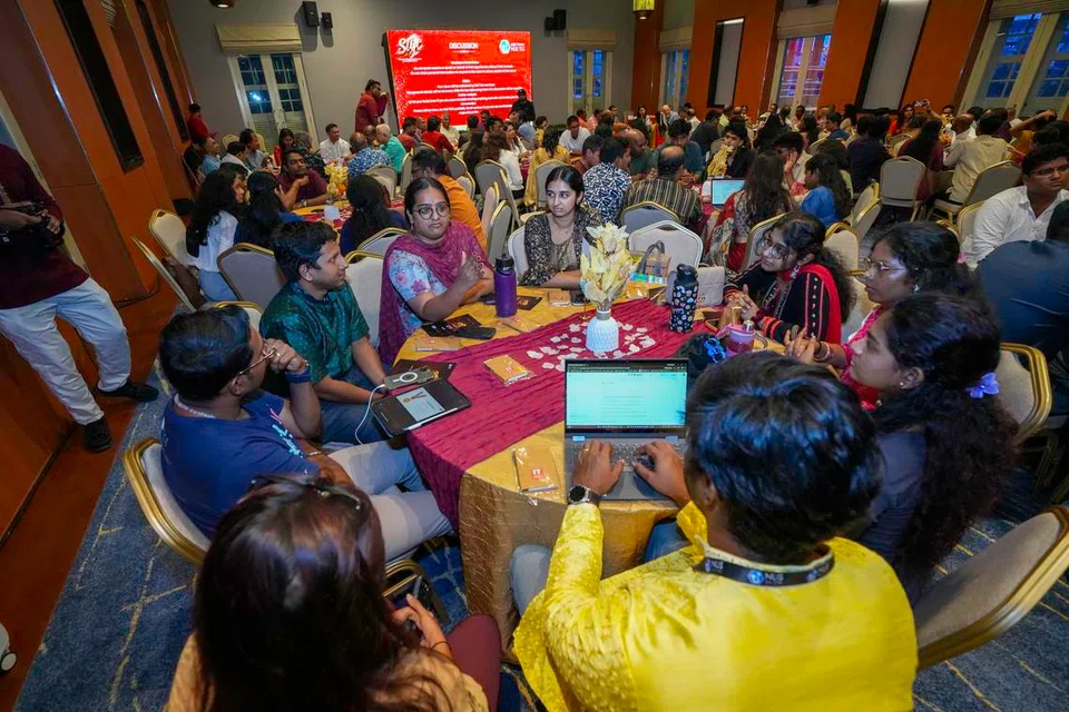 Youth participants involved in group discussions at the Singapore Tamil Youth Conference 2026.