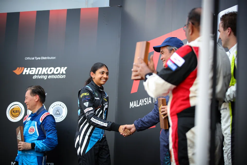 Kareen Kaur finishing her first car race on the podium at Sepang International Circuit during the 2026 Asia Classic Car Challenge.