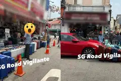 At least four lines of luggage can be seen on the road, stretching beyond the pedestrian pathway outside the shop and covering the double yellow line marker.